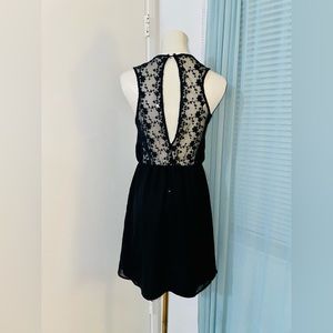 Black mini dress with lace keyhole back detail and cinched waist- size medium